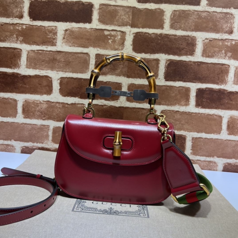 G*u*i top handle bags